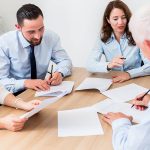 Lawyers having team meeting in law firm