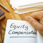 Holding a notebook reading "Equity Compensation"