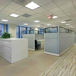 clean office space in a building with cubicles and a view of the entire floor. This is a type of property that would be eligible for the Florida sales tax for commercial properties