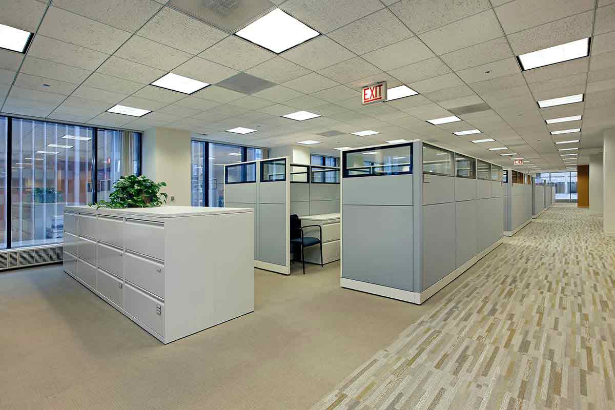 clean office space in a building with cubicles and a view of the entire floor. This is a type of property that would be eligible for the Florida sales tax for commercial properties