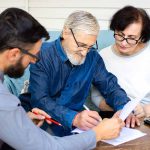 An old couple signing a Revocable trust