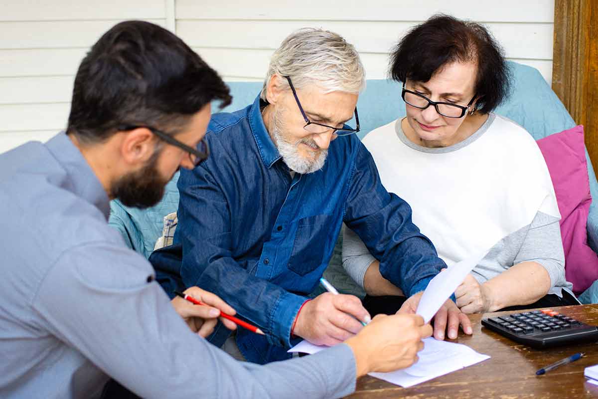 An old couple signing a Revocable trust