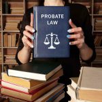 Female attorney holding a book of probate law