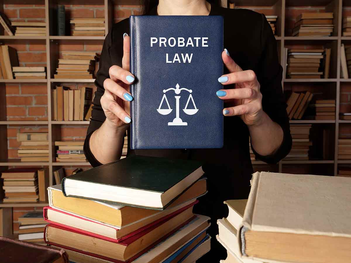 Female attorney holding a book of probate law