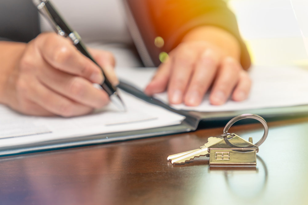 Attorney signing real estate contract