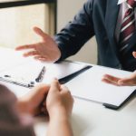 Lawyers discussing business litigation strategy