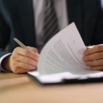 Estate attorney guiding a client through trust administration paperwork