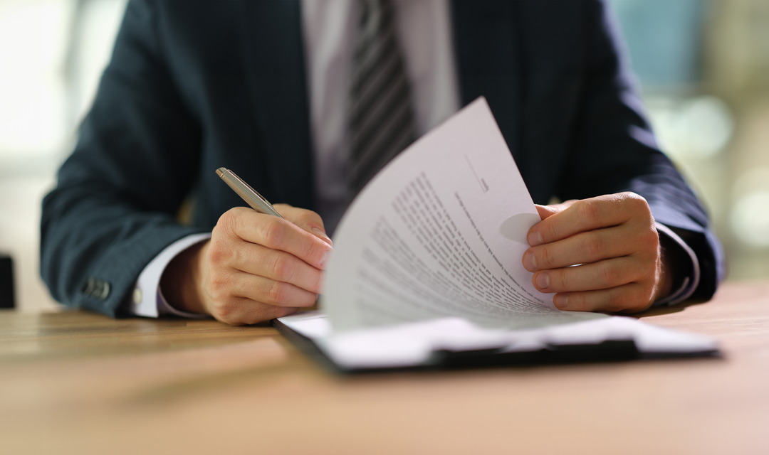 Estate attorney guiding a client through trust administration paperwork