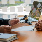 Estate planning attorney reviewing trust documents with a client