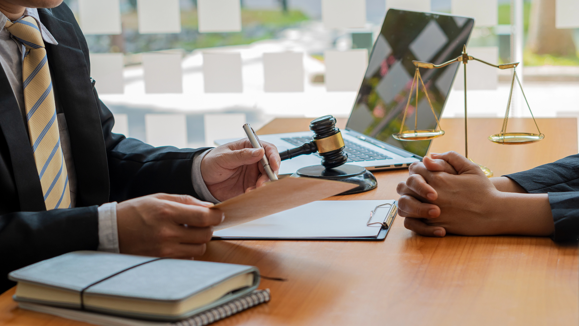 Estate planning attorney reviewing trust documents with a client