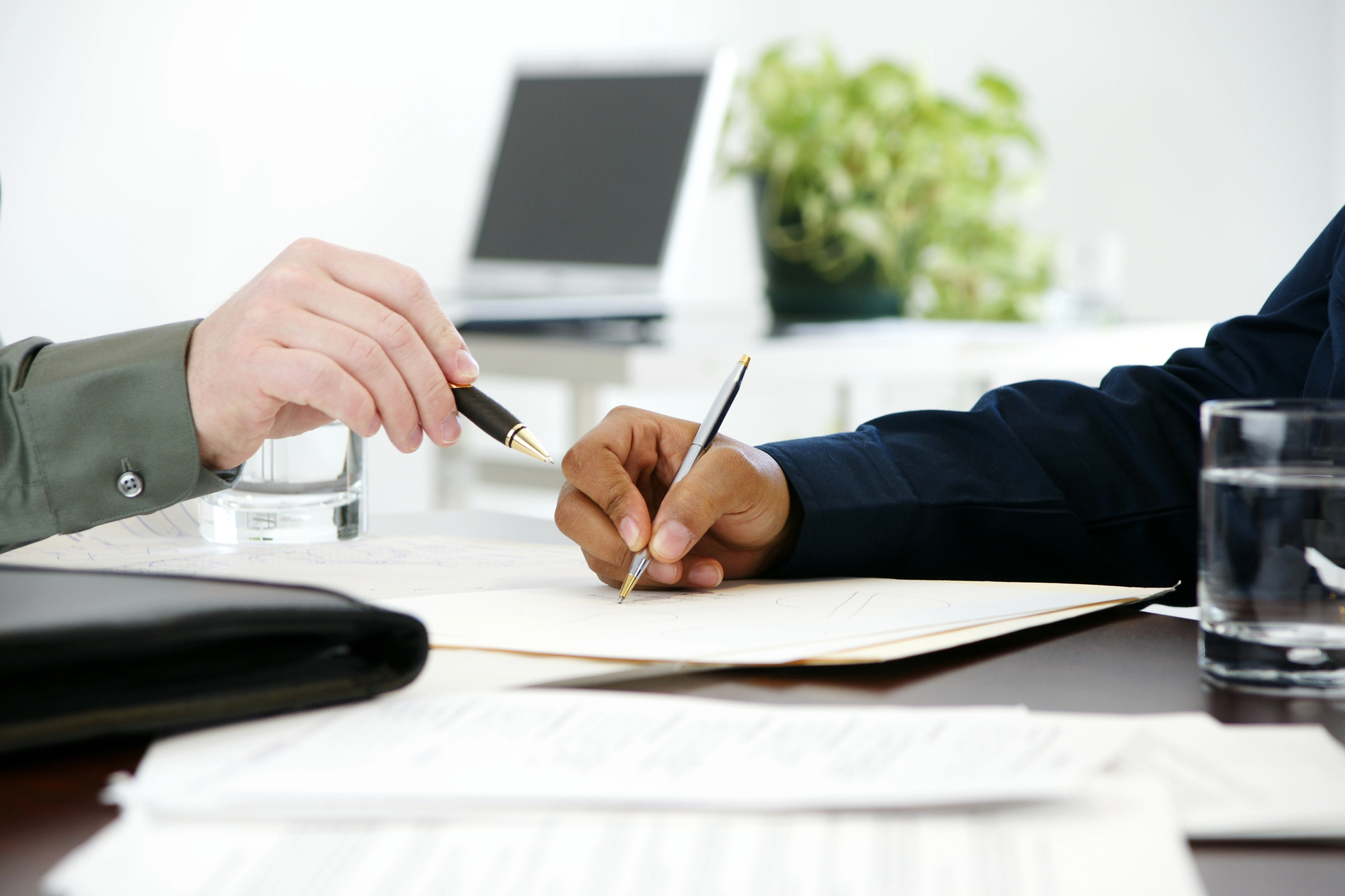 Person trust and estate documents with an attorney at a desk